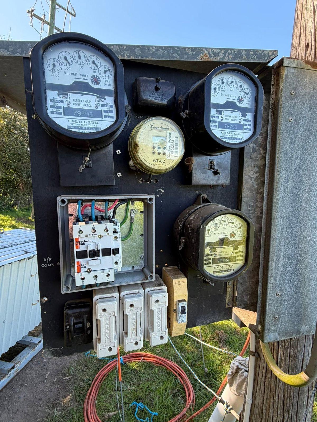 Farm meter panel with a pump contactor, new breakers and the original meters