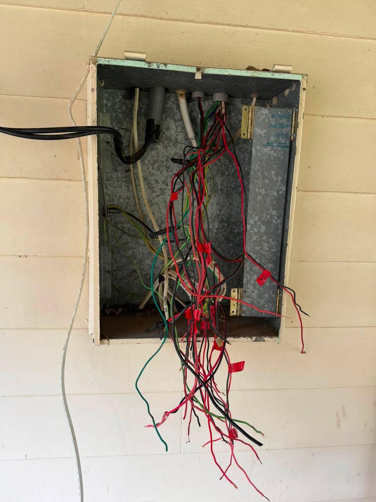 Switchboard enclosure stripped back to the cables partway through an upgrade